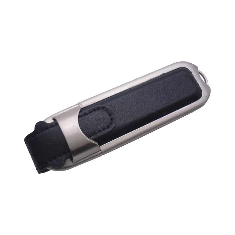 A metal and black leather flash drive with a sleek design, featuring a secure clip and branding. Metal Leather Flash Drive - Image 1