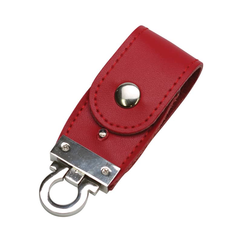 A red PU leather flip drive featuring a silver metal latch and button closure, with a shiny logo. PU Leather Flip Drive - Image 1