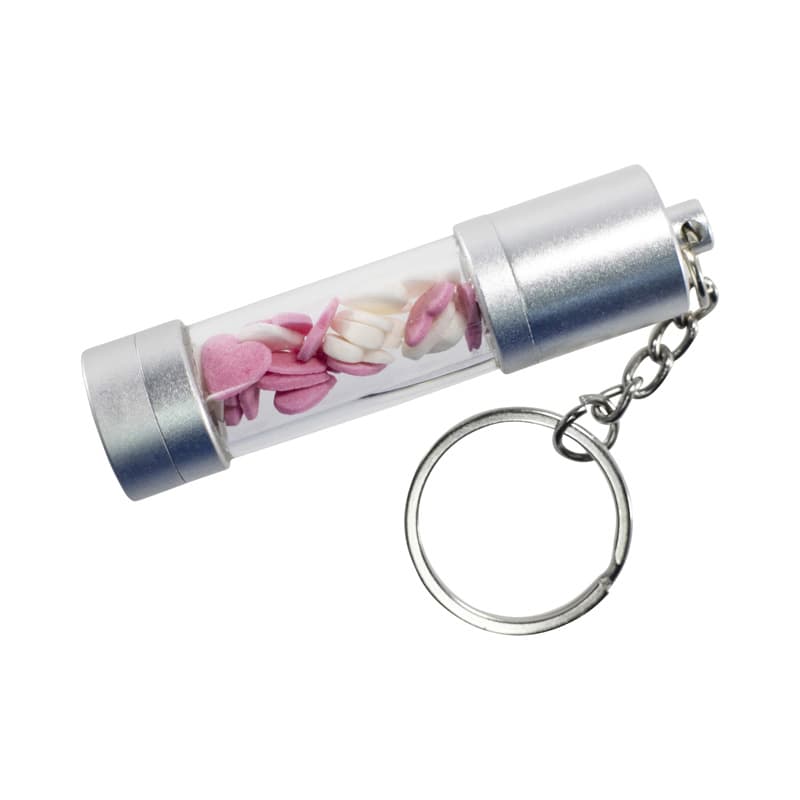 A silver storage LED USB drive in a transparent casing, featuring decorative pink and white shapes, attached to a keychain. Storage LED USB - Image 1