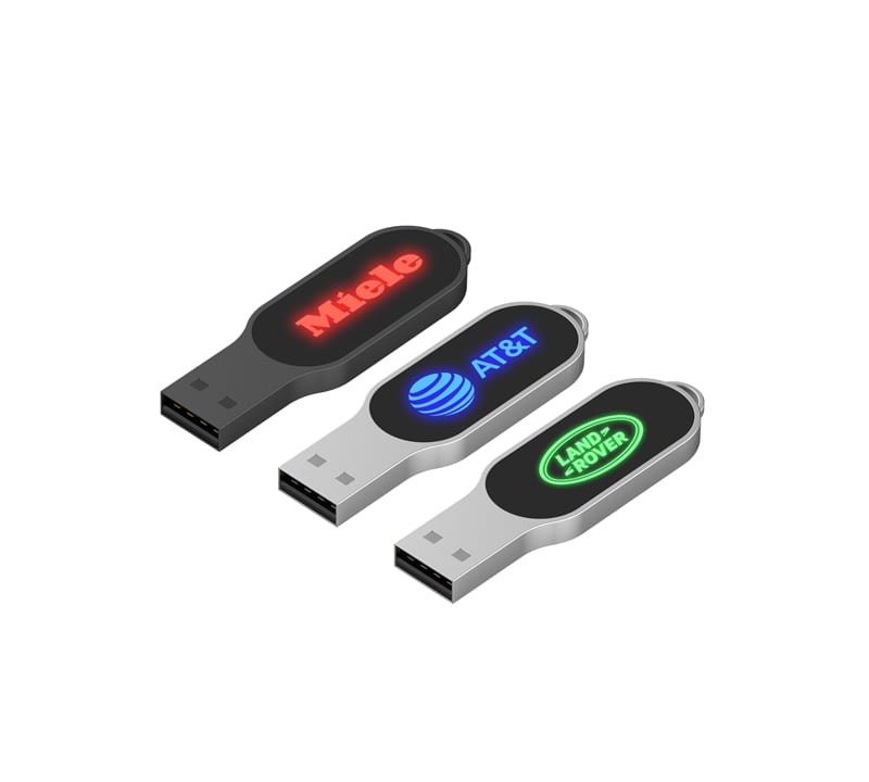 Three LED flash drives in black and silver, featuring logos on their sides in red and green illumination. Olympia LED Flash Drive - Image 1