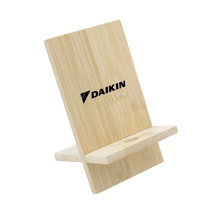 A bamboo phone stand with a sleek design and a logo, featuring a natural wood finish. Groove Bamboo Phone Stand - Image 1