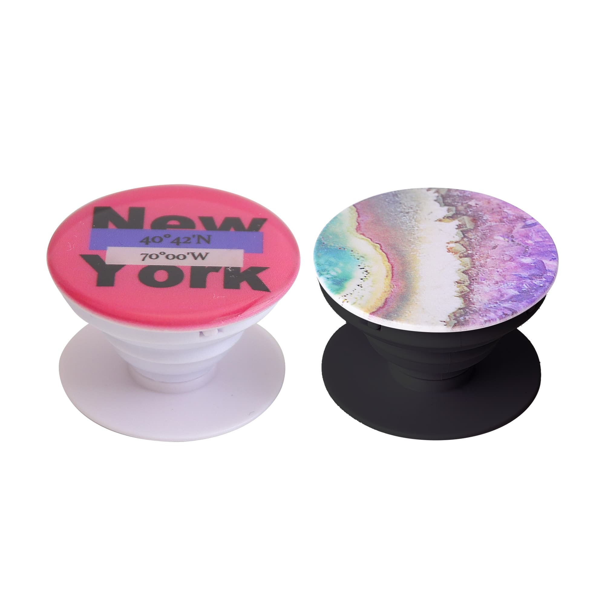 Two phone pop holders in different designs: one pink with text and one featuring a colourful abstract pattern. Both have a logo. Phone Pop Holder - Image 1