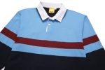 A sports jumper featuring blue, maroon, and navy stripes, with a white collar and a logo on the chest.