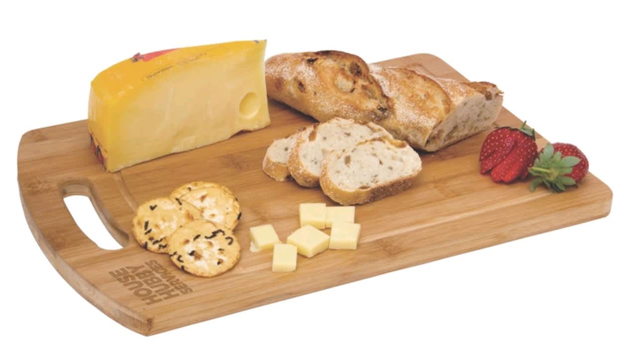 A bamboo cheese board featuring a block of cheese, sliced bread, crackers, and strawberries. It has a logo. Top Chop - Image 1