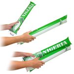A pair of green and white cheering bang bang sticks with a logo, held in hands, ready for use.