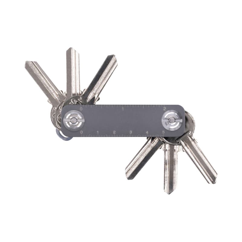 A metallic key organiser with multiple key slots and a measuring ruler, featuring a sleek design. Keyper Case - Image 1