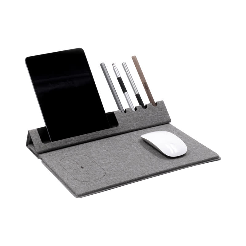 A grey mouse pad with a built-in phone holder, pen slots, and a wireless charging area for devices. Evopad Charge Eco Mouse Pad (RPET) - Image 1