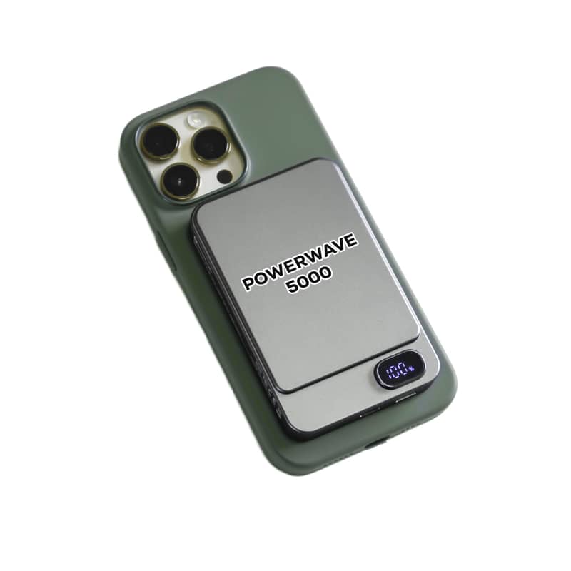 A green and silver magnetic wireless power bank with a digital display and branding. Powerwave 5000 Eco Magnetic Wireless Power Bank - Image 1