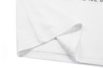 A white cotton t-shirt featuring a folded hem and sleeve, with a logo on the fabric.