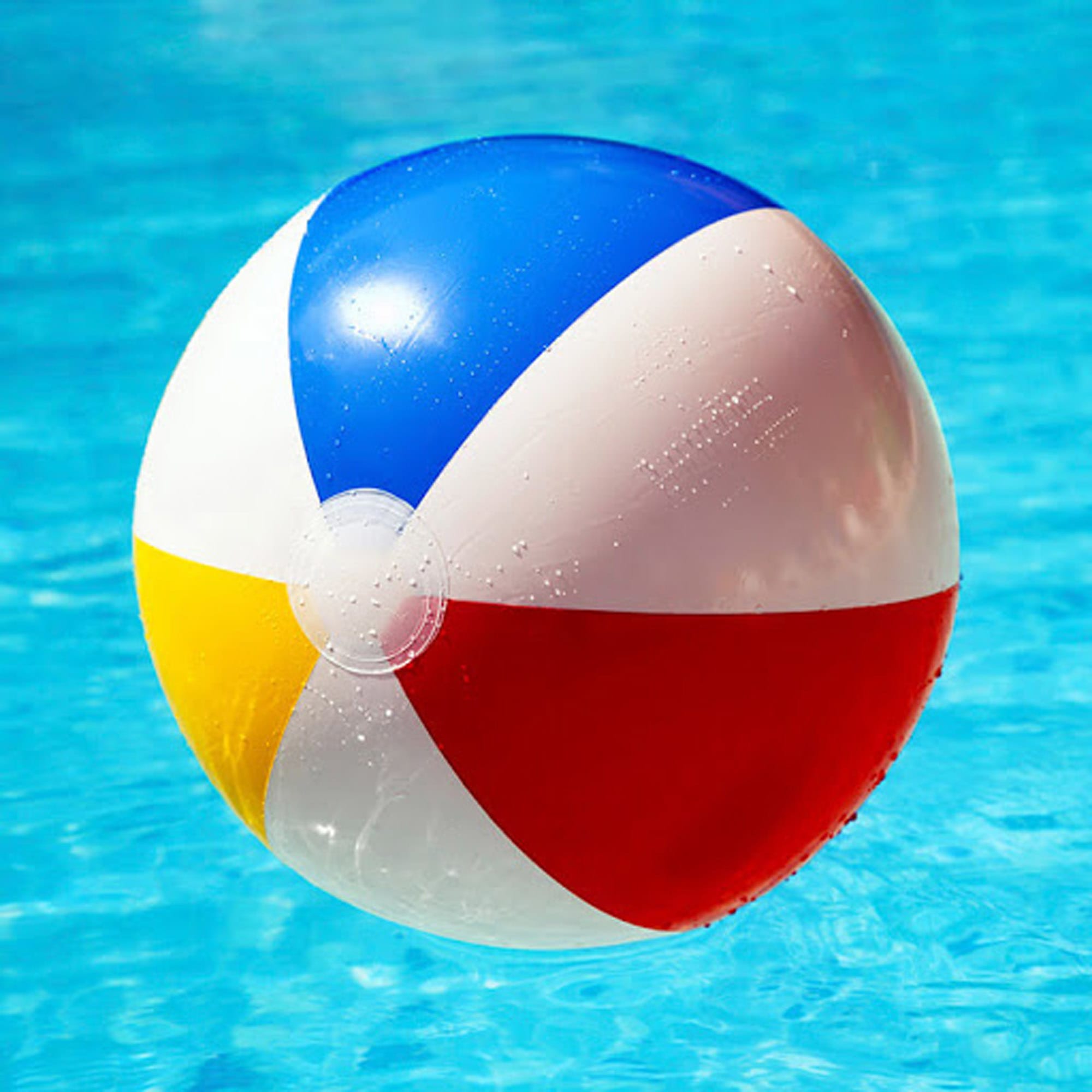 A vibrant beach ball featuring blue, red, yellow, and white panels, floating in a pool of water. Cheerful Beach Ball 48cm - Image 1