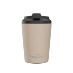 A reusable cup in beige with a black lid, featuring a logo. Holds 230ml (8oz) of liquid.