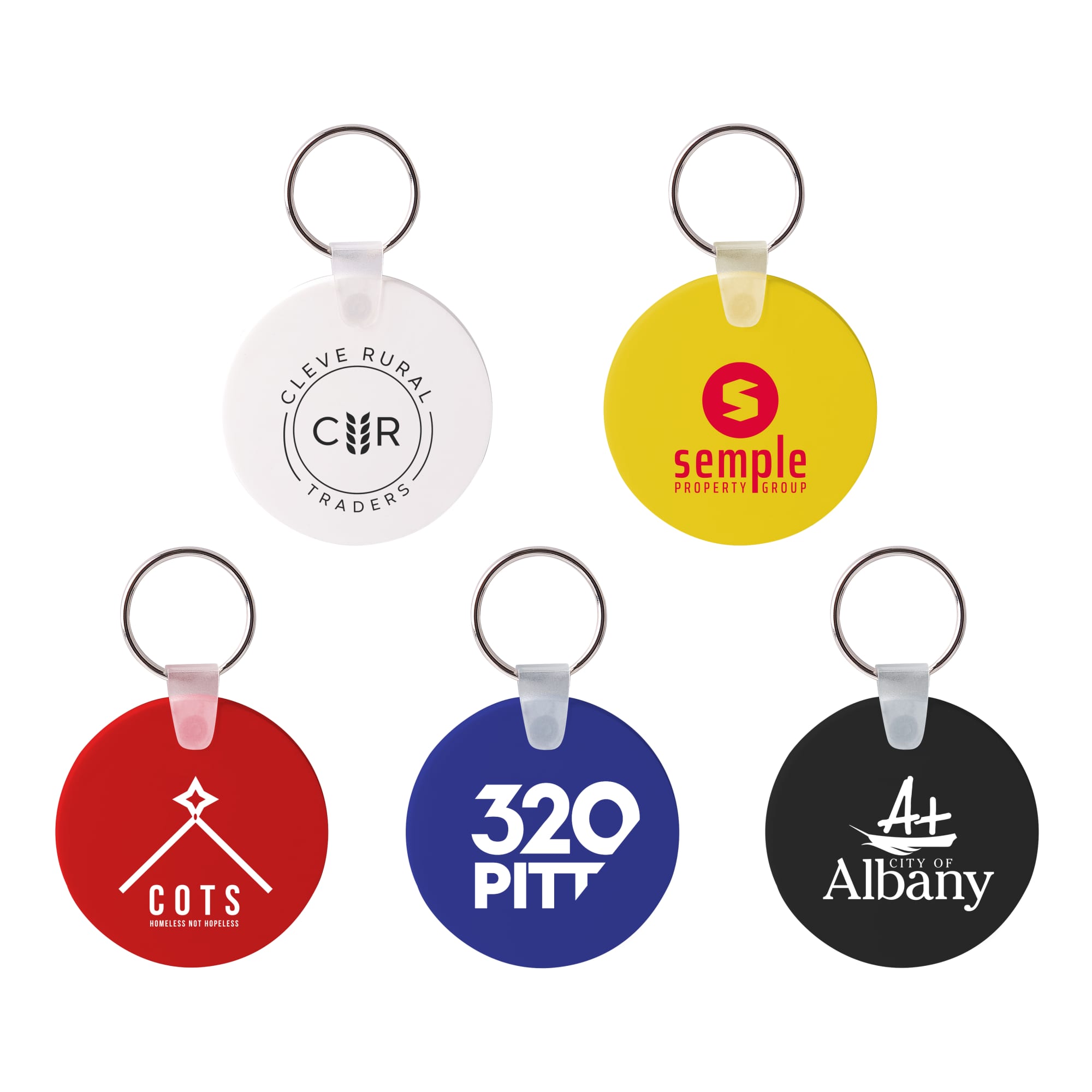 A collection of round Durasoft keyrings in white, red, blue, yellow, and black, each featuring a logo. Round Durasoft Keyring - Image 1