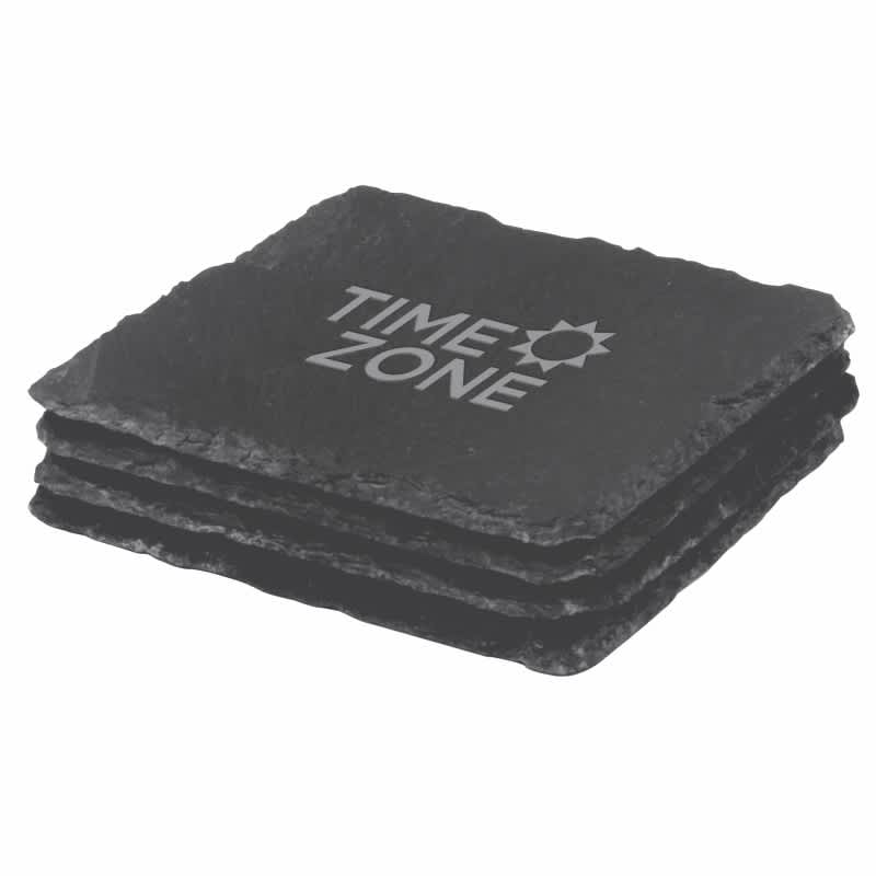 A set of four black slate coasters stacked together, featuring a logo on the top coaster. Chateau Coaster Set - Image 1