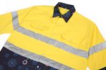 A bright yellow cotton Hawaiian shirt with reflective stripes and a patterned navy bottom section, featuring a logo.
