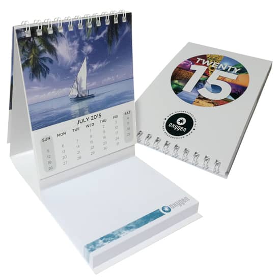 A promotional mini calendar featuring a scenic sailboat image and a colourful design, with a white spiral binding. MiniCalendarSNCombo4c1p - Image 1