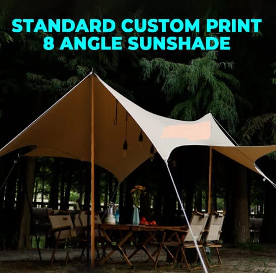 A tan canopy with eight angles set up outdoors among trees, featuring poles and hanging lights. Camping Canopy 8 Angel + Poles - Image 1