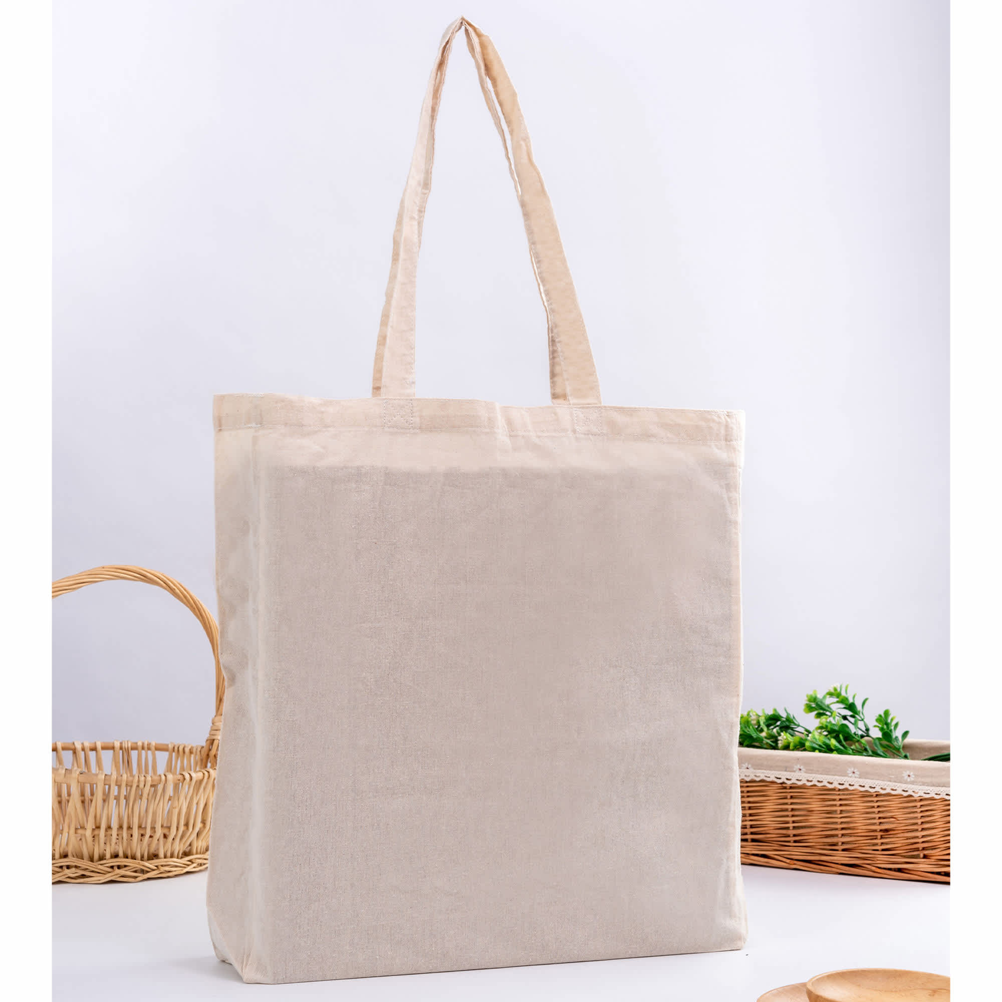 A neutral-coloured tote bag with gusset and two handles, featuring a simple design and a logo. Calico Bag with Gusset - Image 1