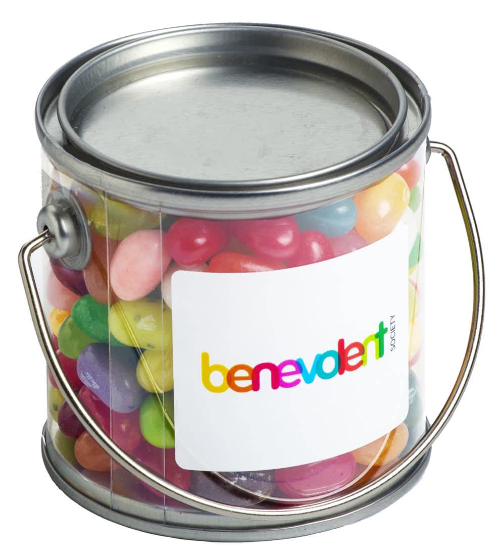 A small clear PVC bucket filled with colourful JELLY BELLY jelly beans, featuring a silver handle and a branding label. Small PVC Bucket with JELLY BELLY Jelly Beans 180g - Image 1