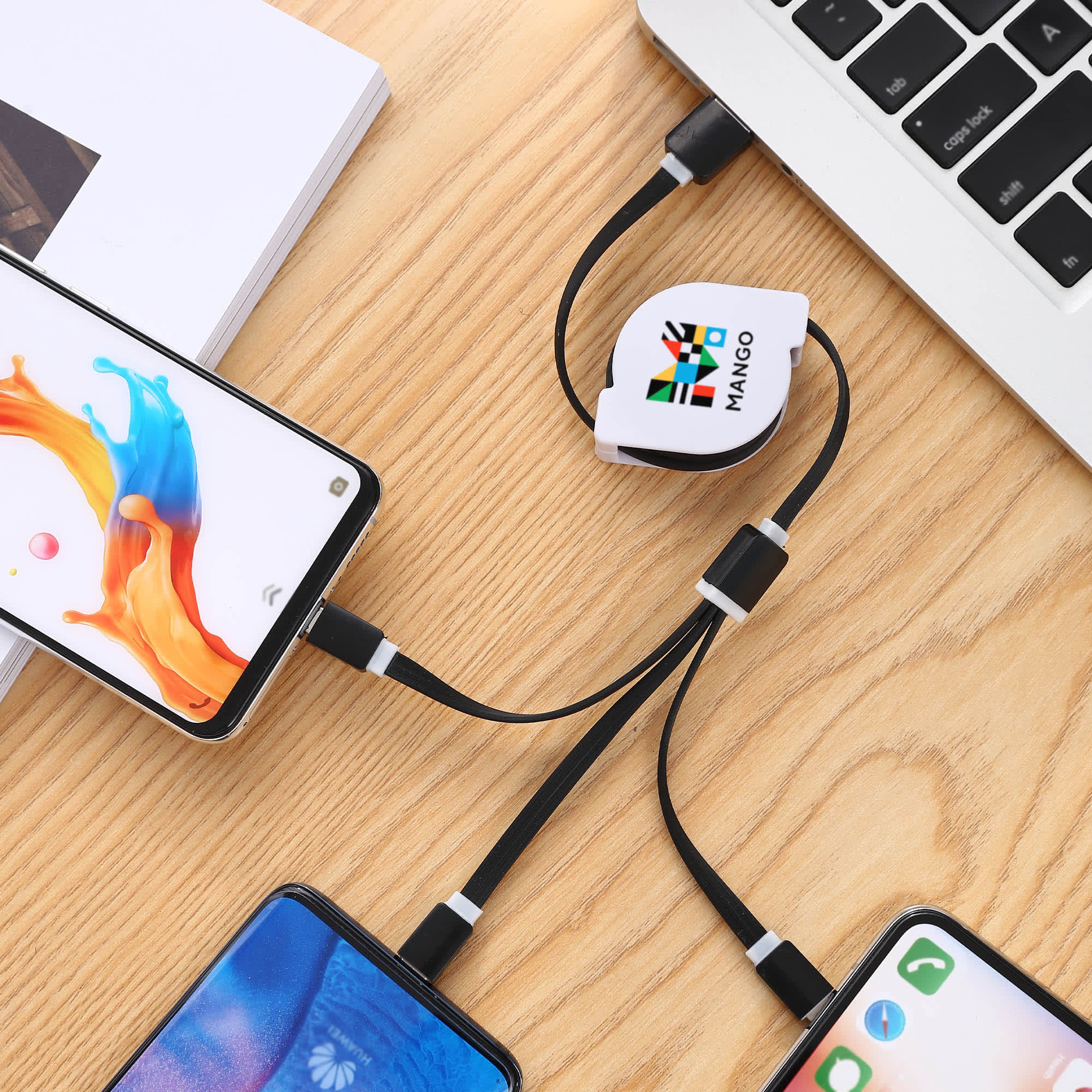 A retractable charging cable in black and white, connecting multiple smartphones to a laptop on a wooden surface. Kyomo Retractable Charging Cable - Image 1