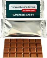 An 80g chocolate bar with a shiny silver wrapper and a rectangular shape, featuring a brown chocolate surface with squares.