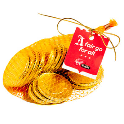 A mesh bag filled with shiny gold chocolate coins, featuring a tag and tied with a golden ribbon. 60g Chocolate Coins in Mesh Bag - Image 1