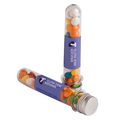 A test tube filled with colourful chewy fruit sweets, featuring a silver cap and a logo on the side. Test Tube with Chewy Fruits 40g - Image 1