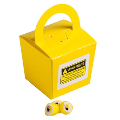 A yellow noodle box containing personalised rock candy pieces in various colours. A yellow noodle box containing personalised rock candy pieces in various colours.