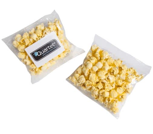 A clear bag of yellow buttered popcorn, featuring a logo on the packaging. Buttered Popcorn 20G - Image 1