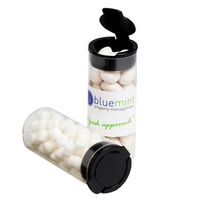 A clear flip lid tube containing white mints, with a black cap and a logo on the side. Flip Lid Tube with Chewy Mints 35g - Image 1