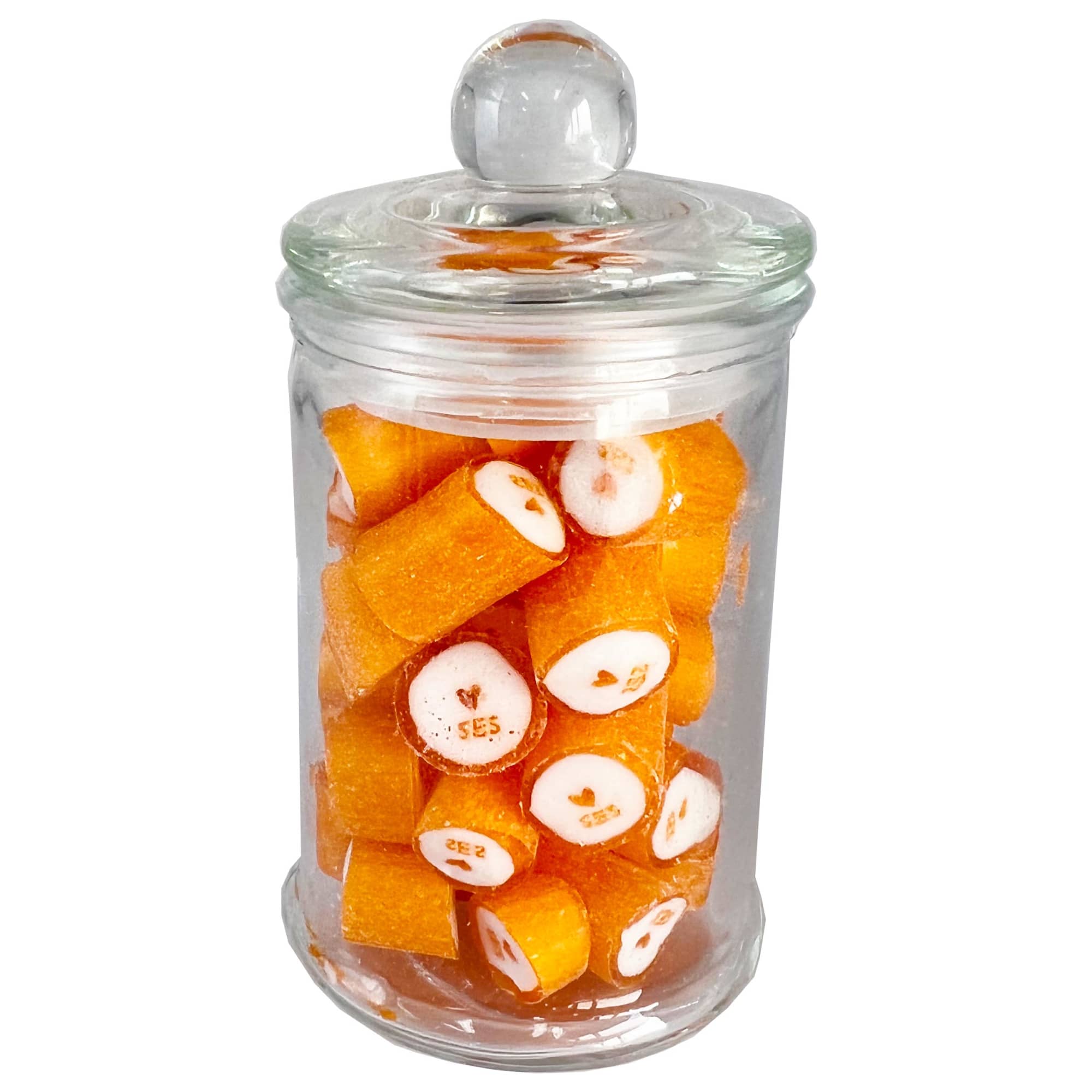A glass apothecary jar filled with orange rock candy pieces, featuring a clear lid. A glass apothecary jar filled with orange rock candy pieces, featuring a clear lid.