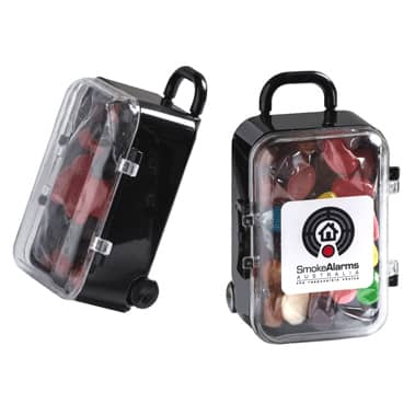 A carry-on case designed in black, filled with colourful jelly beans and featuring a logo. Carry-On Case with Mini Jelly Beans 50g - Image 1