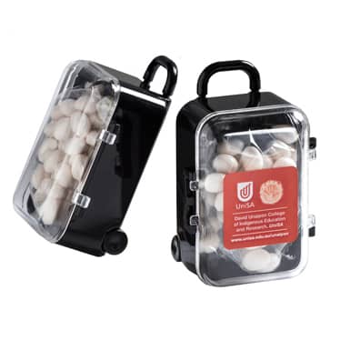 A black carry-on case containing white mints, featuring a transparent lid and a handle. It has a logo on the side. Carry-On Case with Chewy Mints 50g - Image 1