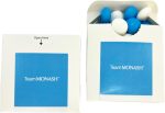 A flip lid cardboard box containing chocolate beans in blue and white. The box has a logo on the front.