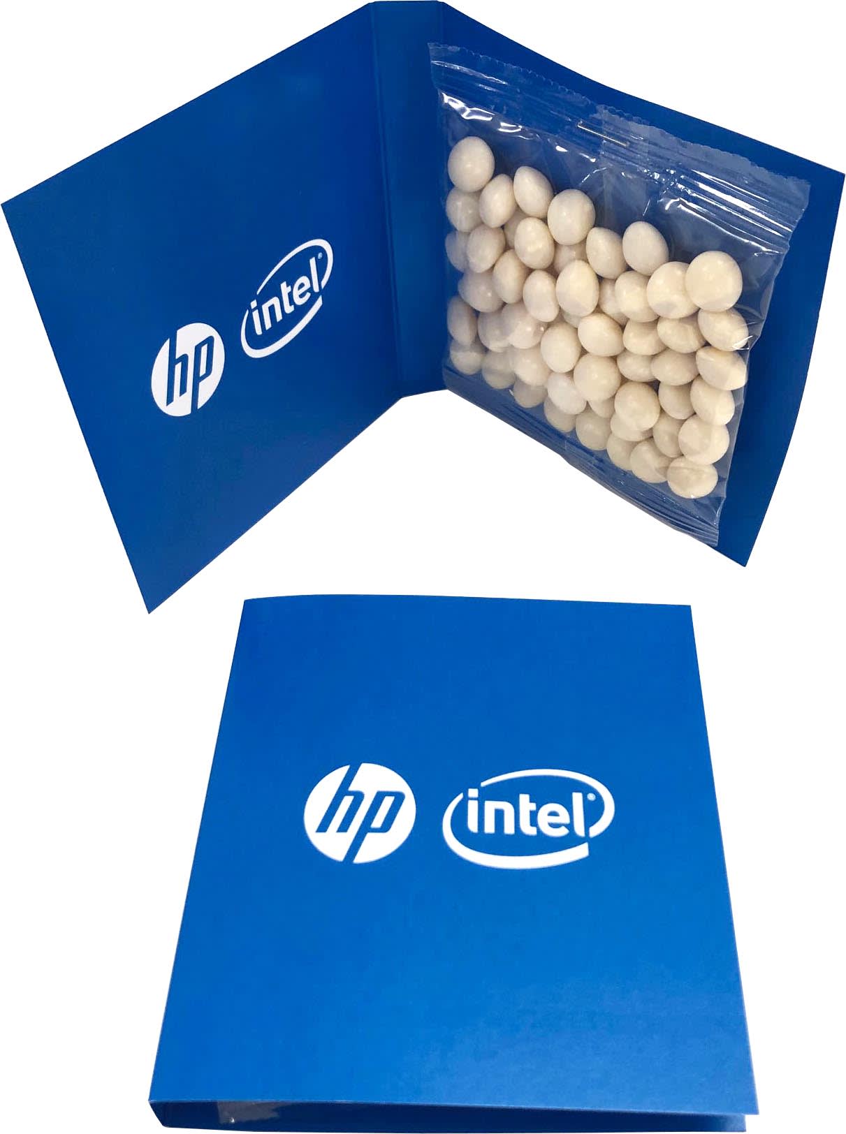 A blue gift card holder featuring a clear bag of white chewy mint balls inside, with logos on the cover. A blue gift card holder featuring a clear bag of white chewy mint balls inside, with logos on the cover.