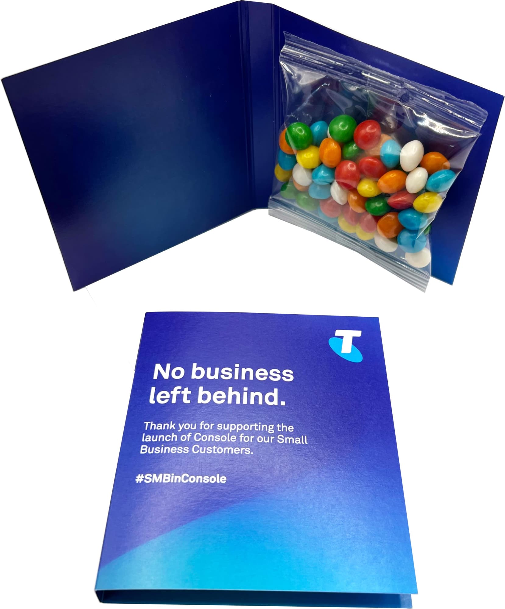 A blue promotional card with a bag of multi-coloured chewy fruit candies inside. The card features a logo. Gift Card with Chewy Fruits 25g - Image 1
