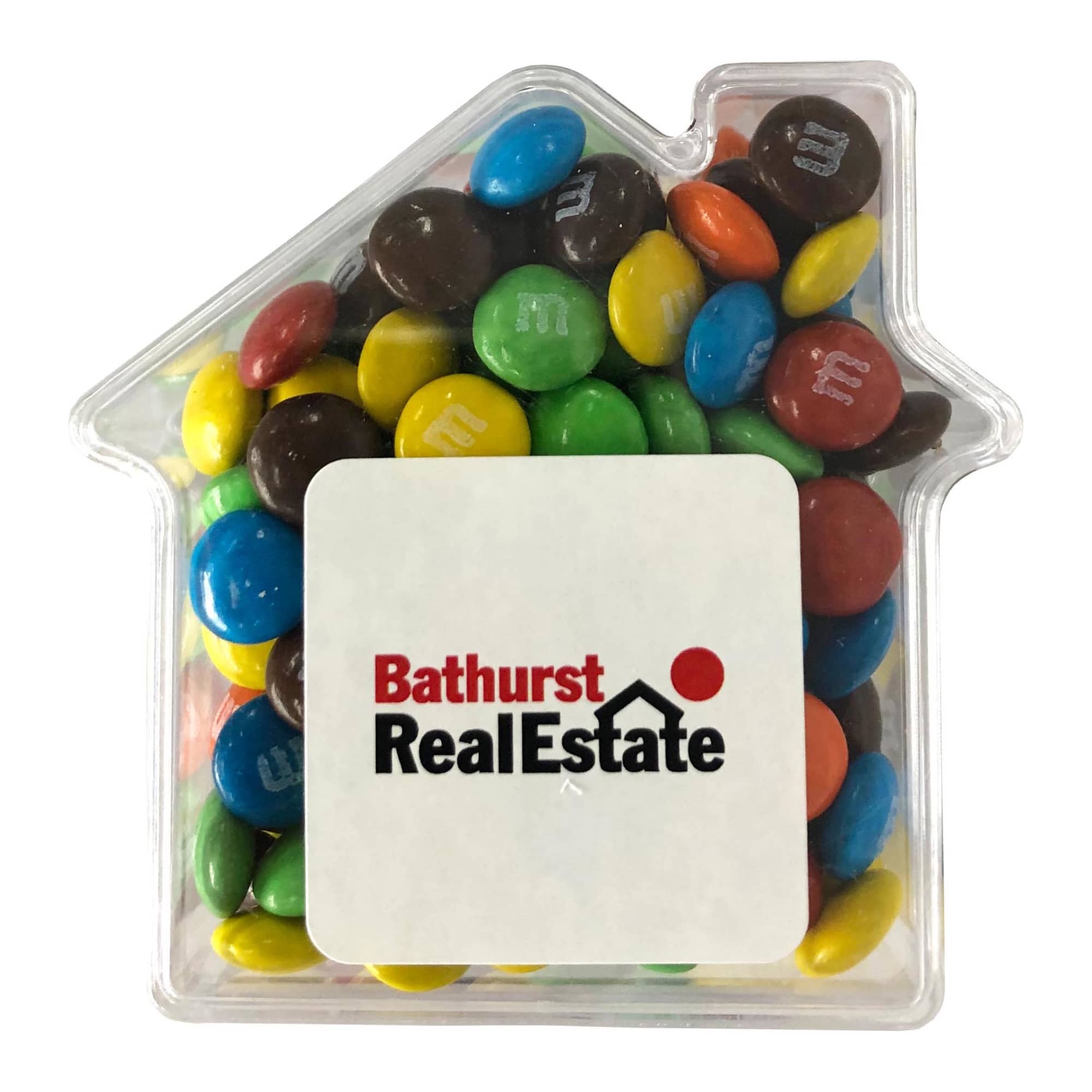 A clear acrylic house filled with colourful M&Ms in various shades of blue, green, red, yellow, and brown. A clear acrylic house filled with colourful M&Ms in various shades of blue, green, red, yellow, and brown.