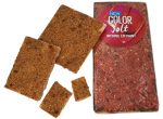 A transparent pack containing several pieces of freeze-dried strawberries in a rich red colour.