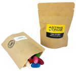 A kraft paper bag containing colourful jelly beans, with another closed bag beside it, featuring a logo.