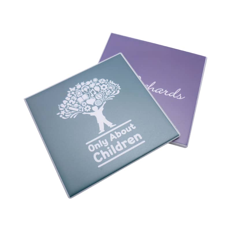 A teal and purple welded coaster featuring a tree graphic and a logo. The coaster is square-shaped. Welded Coaster - Image 1