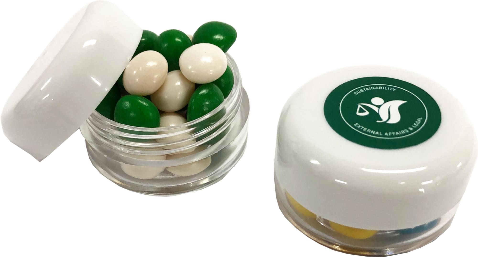 A small screw cap jar filled with green and white chewy fruit candies, featuring a branded lid. A small screw cap jar filled with green and white chewy fruit candies, featuring a branded lid.