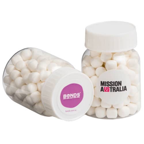 A clear jar containing white mints, featuring a logo on one side. The jar is transparent with a sealed lid. A clear jar containing white mints, featuring a logo on one side. The jar is transparent with a sealed lid.