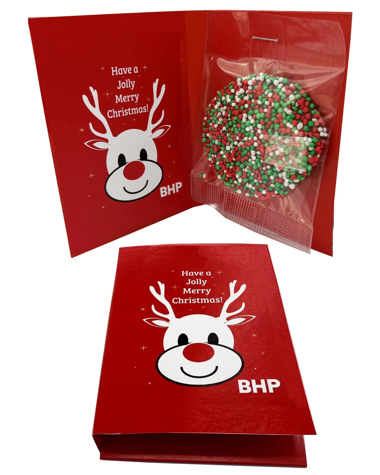A red gift card featuring a reindeer design, with a chocolate disc decorated in red, green, and white sprinkles inside. A red gift card featuring a reindeer design, with a chocolate disc decorated in red, green, and white sprinkles inside.