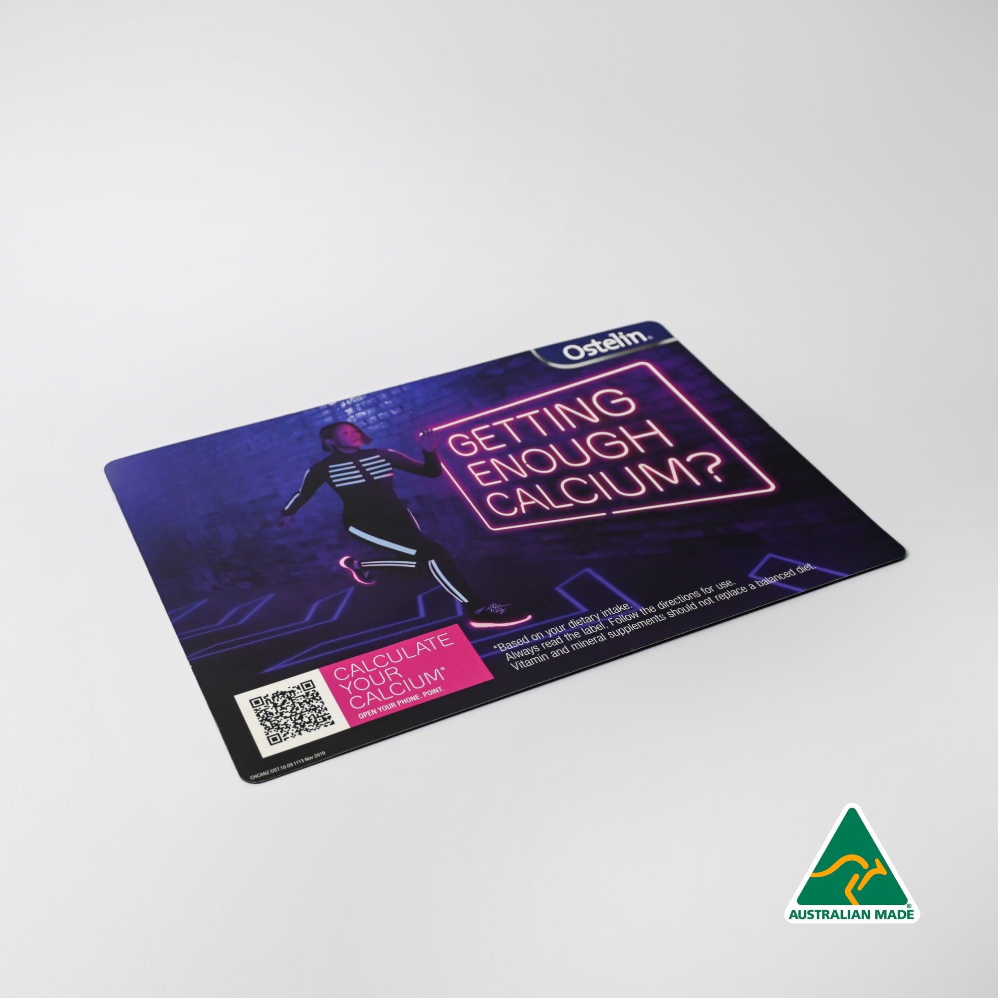 A counter mat featuring a vibrant design with a person and a logo, predominantly in dark colours. Ultimate Counter Mat (420mm x 297mm x 1mm) - Image 1