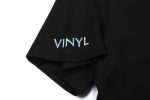 A black cotton t-shirt featuring a sleeve logo in light blue text.