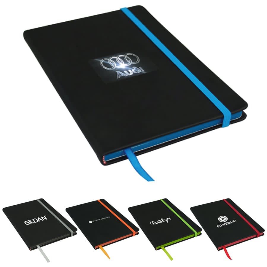 A black A5 journal with an elastic band in blue, featuring various other coloured journals in the background. Edge A5 Journal - Image 1