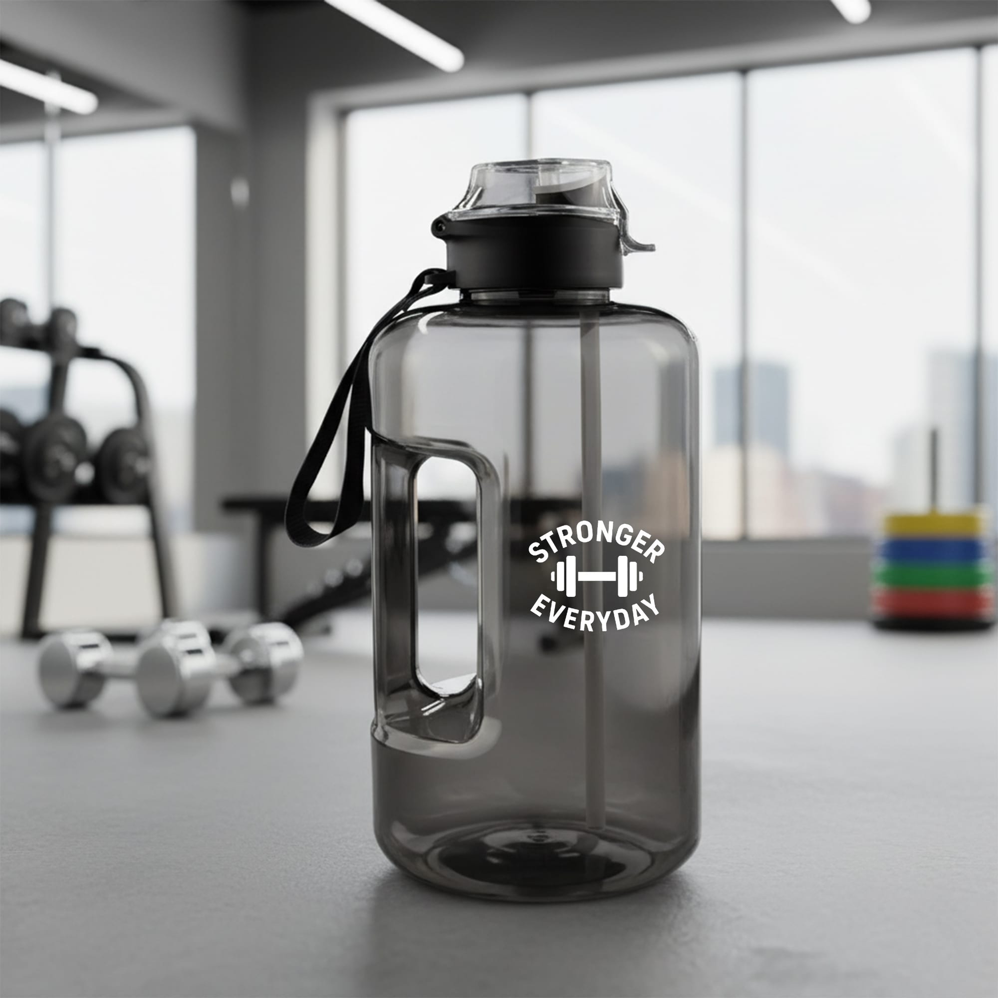 A drink bottle in grey with a handle and a black lid, featuring a logo on one side. Giant Water Bottle 2.2L - Image 1
