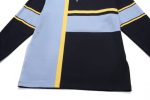 A sports jumper with a colour block design featuring blue, black, and yellow stripes, including a logo.