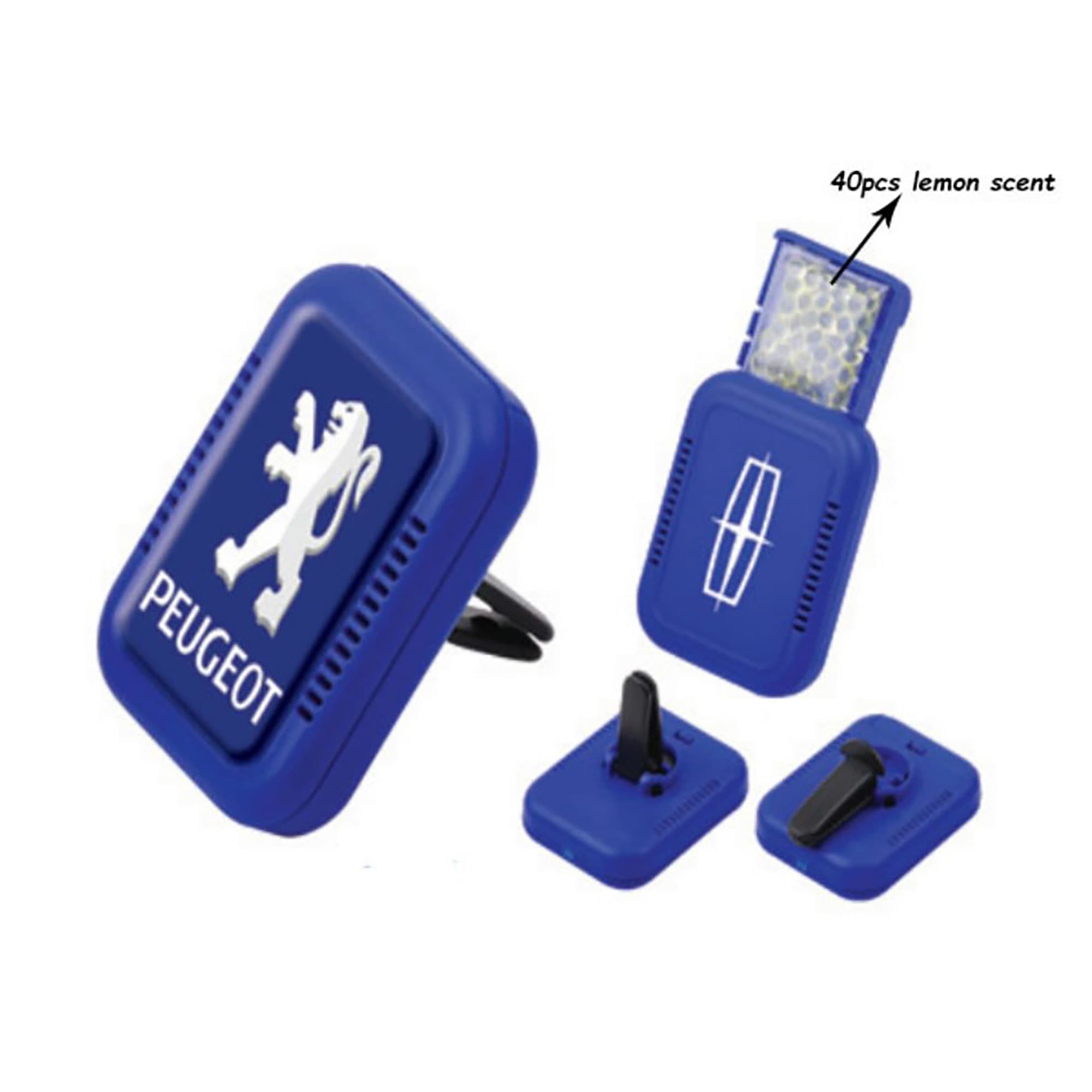 A blue car air freshener featuring a logo, designed with a lemon scent and a compact design. Car Air Fresher - Image 1