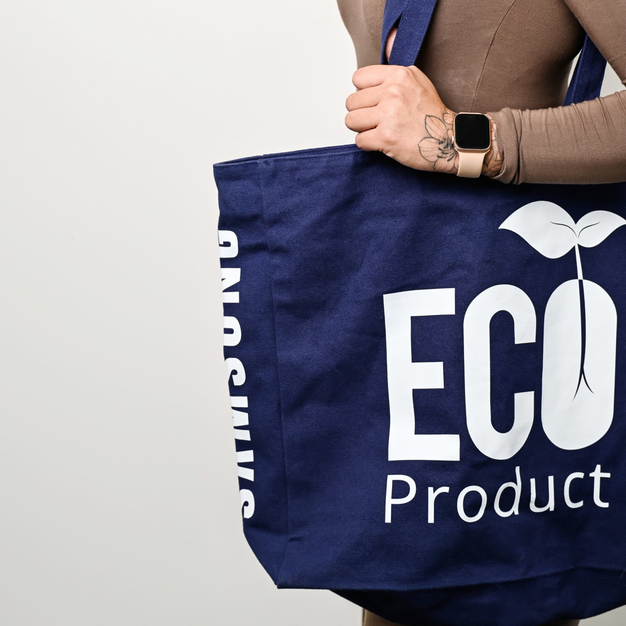 A navy recycled tote bag with a logo and text. It has sturdy handles and a spacious design. Lamar Recycled Large Tote Bag - Image 1