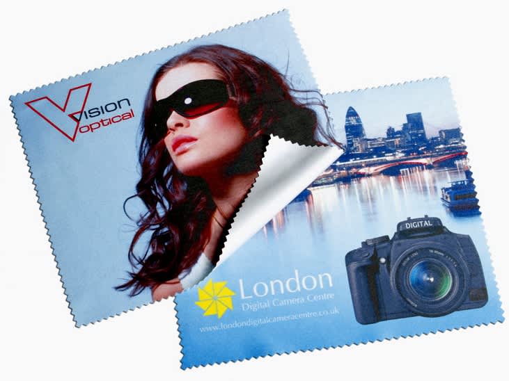 A microfibre cleaning cloth featuring a model in sunglasses and a camera graphic, predominantly blue with a logo. Microfibre Cloth 10x10cm - Image 1